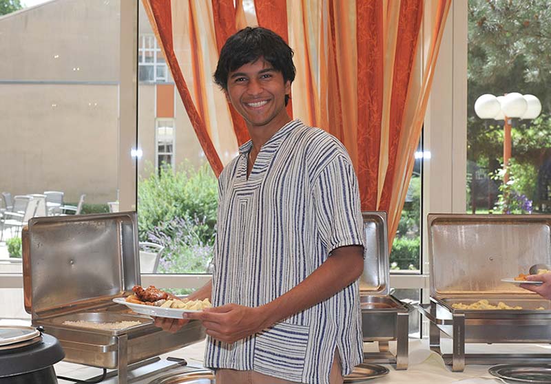 Student boy at a lunch buffet