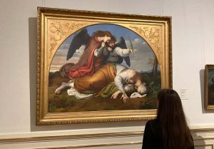 A young girl admiring a paintin in a Viennese museum