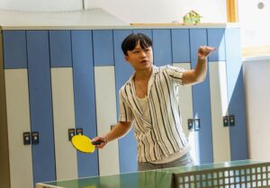 Teenage Boy playing table tennis