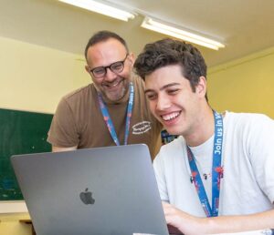 teacher-student2-650-560px Teacher and student in front of a Macbook